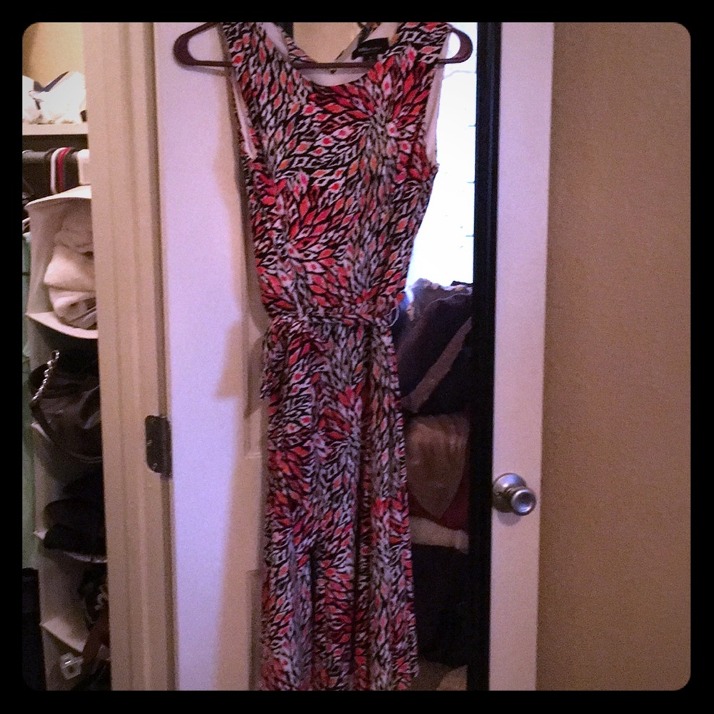 Coral/white/black patterned dress.